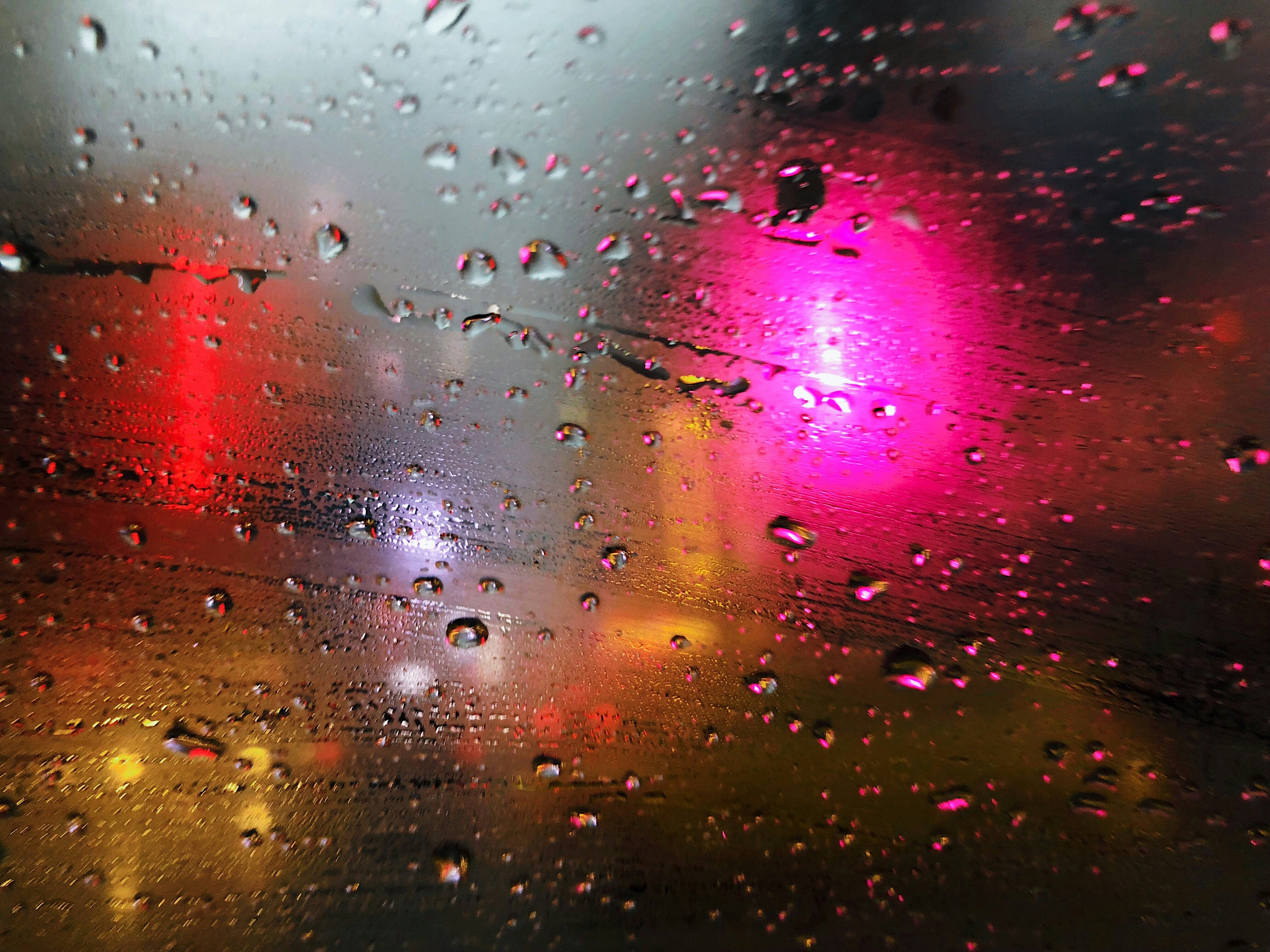 close-up photography of raindrops on glass